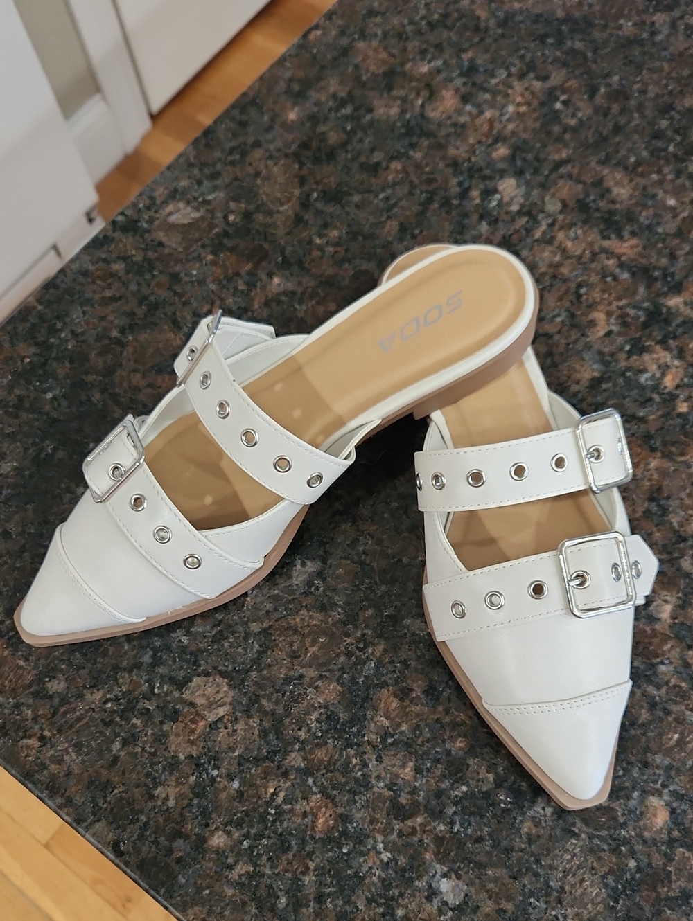 Soda Cream Pointed Buckle Grommet Mules